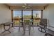 A cozy balcony features a seating area with views of the cityscape and surrounding greenery at 11590 Shipwatch Dr # 342, Largo, FL 33774
