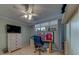 This bedroom features tiled floors, light blue walls, a ceiling fan, and a built-in wardrobe at 11590 Shipwatch Dr # 342, Largo, FL 33774