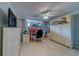 The bedroom features tiled floors, light blue walls, a ceiling fan, and a built-in wardrobe at 11590 Shipwatch Dr # 342, Largo, FL 33774
