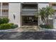 A well-maintained building entrance with landscaping and clear signage welcomes visitors at 11590 Shipwatch Dr # 342, Largo, FL 33774