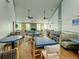 Community dining room with multiple tables and a fireplace at 11590 Shipwatch Dr # 342, Largo, FL 33774