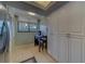 Bright kitchen eating area features a window, table, and plenty of pantry storage space at 11590 Shipwatch Dr # 342, Largo, FL 33774