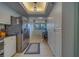 Galley-style kitchen with plenty of storage, an eating area and stainless steel refrigerator at 11590 Shipwatch Dr # 342, Largo, FL 33774