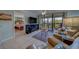 Inviting living room features a comfortable sofa, stylish decor, and sliding glass doors to a balcony at 11590 Shipwatch Dr # 342, Largo, FL 33774
