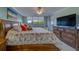 Well lit main bedroom showing bed, bureau and window at 11590 Shipwatch Dr # 342, Largo, FL 33774