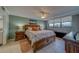 Large main bedroom features an expansive bed, dresser, end tables and views at 11590 Shipwatch Dr # 342, Largo, FL 33774