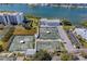 Aerial view of tennis courts and parking lots, near a body of water at 11590 Shipwatch Dr # 342, Largo, FL 33774