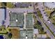 Overhead view of tennis courts and parking lots surrounded by trees, landscaping and green spaces at 11590 Shipwatch Dr # 342, Largo, FL 33774