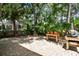 Picturesque backyard with brick pavers, mature trees, and well-maintained landscaping at 1187 Mistwood Dr, Tarpon Springs, FL 34688