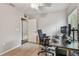 Functional home office featuring dual monitors, office chair, and neutral walls for productivity at 1187 Mistwood Dr, Tarpon Springs, FL 34688