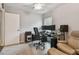Functional home office featuring dual monitors, office chair, and a comfortable armchair for relaxation at 1187 Mistwood Dr, Tarpon Springs, FL 34688