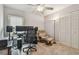 Functional home office featuring dual monitors, office chair, and a comfortable armchair for relaxation at 1187 Mistwood Dr, Tarpon Springs, FL 34688