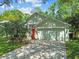 Charming single-Gathering home with a two-car garage, well-manicured lawn and driveway at 1187 Mistwood Dr, Tarpon Springs, FL 34688