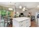 Open-concept living area with island, dining space, and comfortable seating at 1187 Mistwood Dr, Tarpon Springs, FL 34688