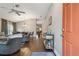 Open-concept living room with hardwood floors, neutral paint, and dining area at 1187 Mistwood Dr, Tarpon Springs, FL 34688