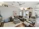 Comfortable living room featuring a sectional sofa, decorative accents, and ample natural light at 1187 Mistwood Dr, Tarpon Springs, FL 34688