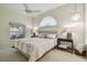 Relaxing main bedroom with comfortable bedding, decorative lamps, and a serene atmosphere at 1187 Mistwood Dr, Tarpon Springs, FL 34688
