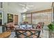 Covered patio offers a relaxing space with tile floor, furnishings, and tranquil views at 1187 Mistwood Dr, Tarpon Springs, FL 34688