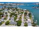 Aerial of waterfront home, boat docks, and city skyline. Ideal for enjoying waterfront living at 14043 E Parsley Dr, Madeira Beach, FL 33708