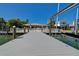 Back exterior view of home, featuring a white fence, back patio and waterfront at 14043 E Parsley Dr, Madeira Beach, FL 33708