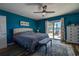 Bright bedroom with a sliding glass door leading to the outdoor patio with a view of the water at 14043 E Parsley Dr, Madeira Beach, FL 33708