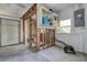 Spacious garage with laundry area and storage shelves at 14043 E Parsley Dr, Madeira Beach, FL 33708