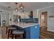 Well-appointed kitchen with an island, stainless steel appliances, and ample counter space for cooking at 14043 E Parsley Dr, Madeira Beach, FL 33708