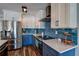 Contemporary kitchen featuring stainless steel appliances, modern cabinets, and stylish countertops at 14043 E Parsley Dr, Madeira Beach, FL 33708