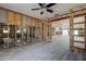 Open concept living room with updated lighting and ceiling fan at 14043 E Parsley Dr, Madeira Beach, FL 33708