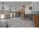 Open concept living room and kitchen area has lots of natural light and views of the backyard at 14043 E Parsley Dr, Madeira Beach, FL 33708