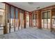 The living room shows exposed wood framing with doorway openings and windows for a customizable layout at 14043 E Parsley Dr, Madeira Beach, FL 33708