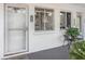 Inviting front porch with seating and charming details adds to the welcoming entrance of this home at 1552 Pleasant Rd # J4, Bradenton, FL 34207