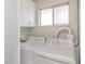 Functional laundry room features a side-by-side washer and dryer at 1552 Pleasant Rd # J4, Bradenton, FL 34207