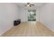 Bright living room featuring neutral walls, tile flooring, and a sliding glass door to a lanai at 1552 Pleasant Rd # J4, Bradenton, FL 34207