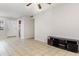 Spacious living room showcasing tile floors and an open layout to the kitchen at 1552 Pleasant Rd # J4, Bradenton, FL 34207