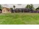 Backyard featuring a screened-in pool and a shed at 16403 Bonneville Dr, Tampa, FL 33624