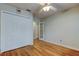 Well-lit bedroom featuring a double closet and a ceiling fan for added comfort at 16403 Bonneville Dr, Tampa, FL 33624