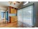 Bright dining area featuring wood floors, natural lighting, and sliding door access to the lanai with pool view at 16403 Bonneville Dr, Tampa, FL 33624