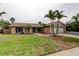 Charming single-story home featuring a well-manicured lawn and two-car garage at 16403 Bonneville Dr, Tampa, FL 33624