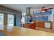 Bright and airy kitchen area with island cooktop and views of the pool at 16403 Bonneville Dr, Tampa, FL 33624