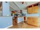 Kitchen with stainless appliances, light wood cabinetry, and hardwood flooring at 16403 Bonneville Dr, Tampa, FL 33624