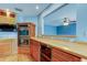 Kitchen featuring custom cabinetry, stainless steel appliances and a wine refrigerator at 16403 Bonneville Dr, Tampa, FL 33624