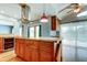Kitchen island with stainless appliances, hardwood flooring, and french doors to backyard at 16403 Bonneville Dr, Tampa, FL 33624