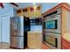 Modern kitchen with stainless steel appliances, including a refrigerator, microwave and double ovens at 16403 Bonneville Dr, Tampa, FL 33624