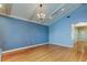 Spacious living room features hardwood floors, a chandelier, and great light at 16403 Bonneville Dr, Tampa, FL 33624