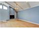 Living room with hardwood floors, fireplace, and vaulted ceilings at 16403 Bonneville Dr, Tampa, FL 33624