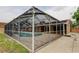 Screened-in pool and patio area connected to the back of the house at 16403 Bonneville Dr, Tampa, FL 33624