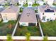 Aerial view of backyard featuring a screened in porch and fenced in yard at 16805 Delia St, Wimauma, FL 33598