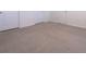 Neutral bedroom features plush carpet, white trim, and two closet doors at 16805 Delia St, Wimauma, FL 33598