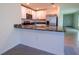 Modern kitchen features stainless steel appliances, granite countertops, and white cabinetry at 16805 Delia St, Wimauma, FL 33598